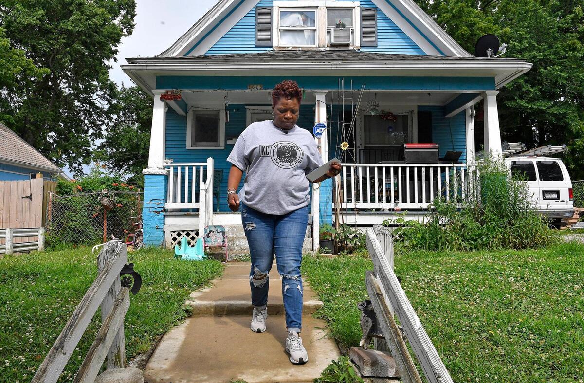 Rosilyn Temple, the Founder and Program Director for KC Mothers in Charge, went door to door Thursday afternoon distributing information and talking with residents about the shooting death of Kaitlyn Mahurin, who was killed June 20th at her home in the 2600 block of Cypress Ave. Mahurin was just 20 years old. Temple called on anyone with information about the shooting to come forward. The door hangers she was carrying had a QR code printed on them so any source could remain anonymous.