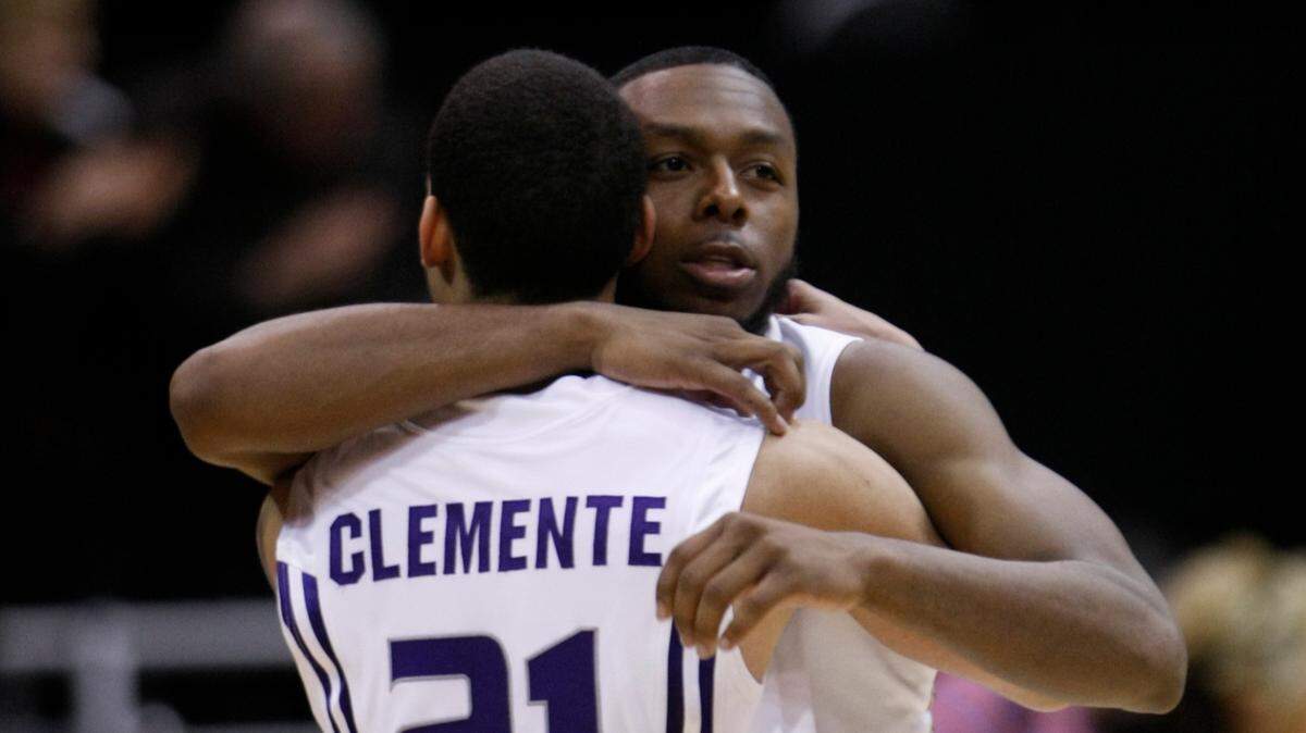 Kansas State’s Denis Clemente hugs teammate Jacob Pullen after an NCAA West Regional semifinal college basketball game in Salt Lake City, Thursday, March 25, 2010. Kansas State beat Xavier, 101-96 in double overtime. (AP Photo/Paul Sakuma) ORG XMIT: OTK ORG XMIT: TK1EMV1A