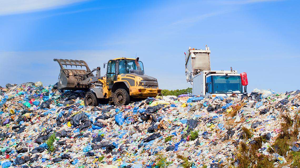 a garbage truck unloading at a landfill trash dump truck 