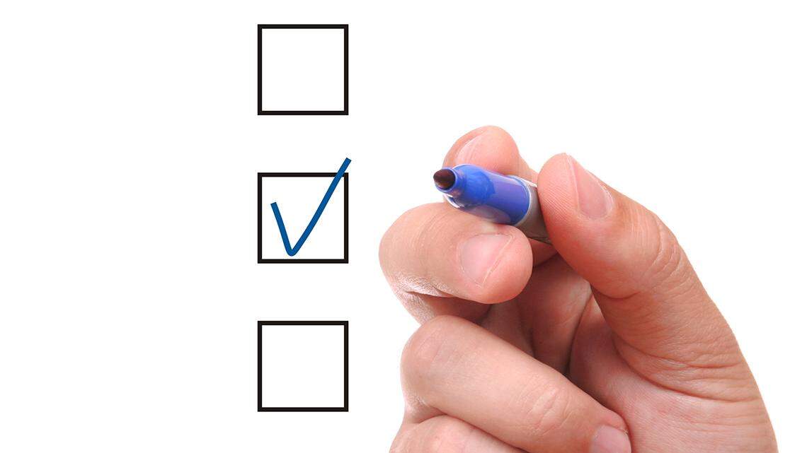 List of check boxes and hand with pen on white background checklist list vote multiple choice text test answer key