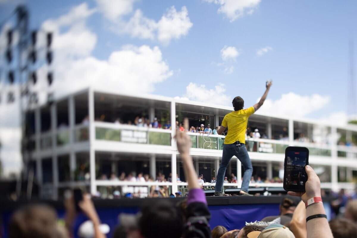 All American Rejects Lead Vocalist Tyson Ritter walks across the stage and throws their arm in the air during their FIFA Fan Fest concert at Fan Fest on Saturday, July 11, 2026.
