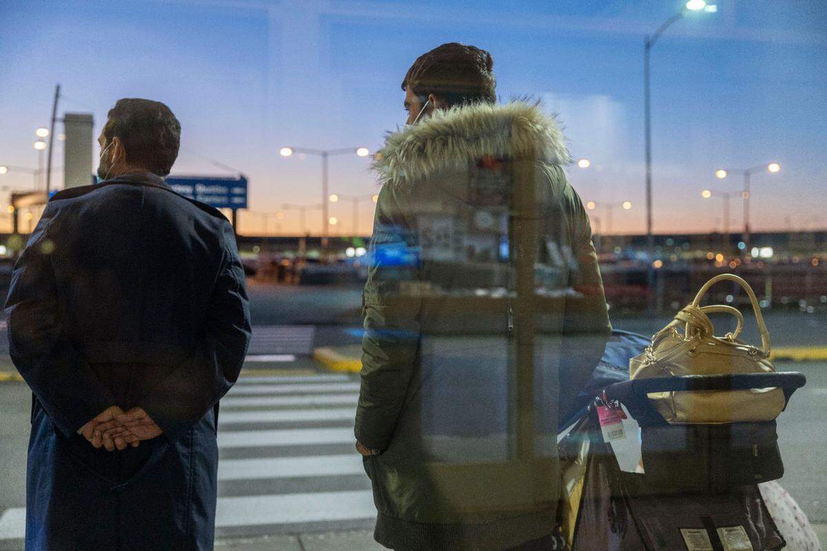 Evacuees from Afghanistan get their first look of Kansas City outside of the terminal at Kansas City International Airport shortly after they arrived on October 29.