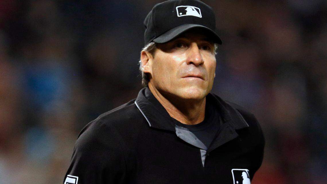 FILE - In this Sept. 3, 2018, file photo, umpire Angel Hernandez (5) is seen in the first inning during a game between the Arizona Diamondbacks the San Diego Padres, in Phoenix. Umpire Ángel Hernández lost his lawsuit against Major League Baseball alleging racial discrimination. The Cuba-born Hernández sued in 2017 in U.S. District Court in Cincinnati, a case later moved to New York. Hired as a big league umpire in 1993, he alleged he was discriminated against because he had not been assigned to the World Series since 2005 and had been passed over for crew chief. (AP Photo/Rick Scuteri, File)