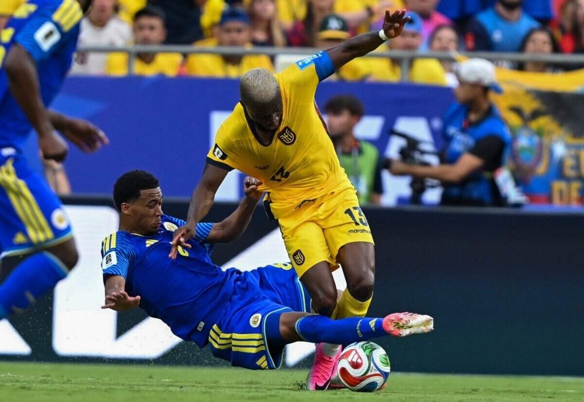 Ecuador forward Enner Valencia (13) is pulled down by Curaçao defender Livano Comenencia (8) in the first half of the Ecuador vs. Curaçao FIFA World Cup group-stage soccer match at Kansas City (Arrowhead) Stadium in Kansas City on Saturday, June 20, 2026.