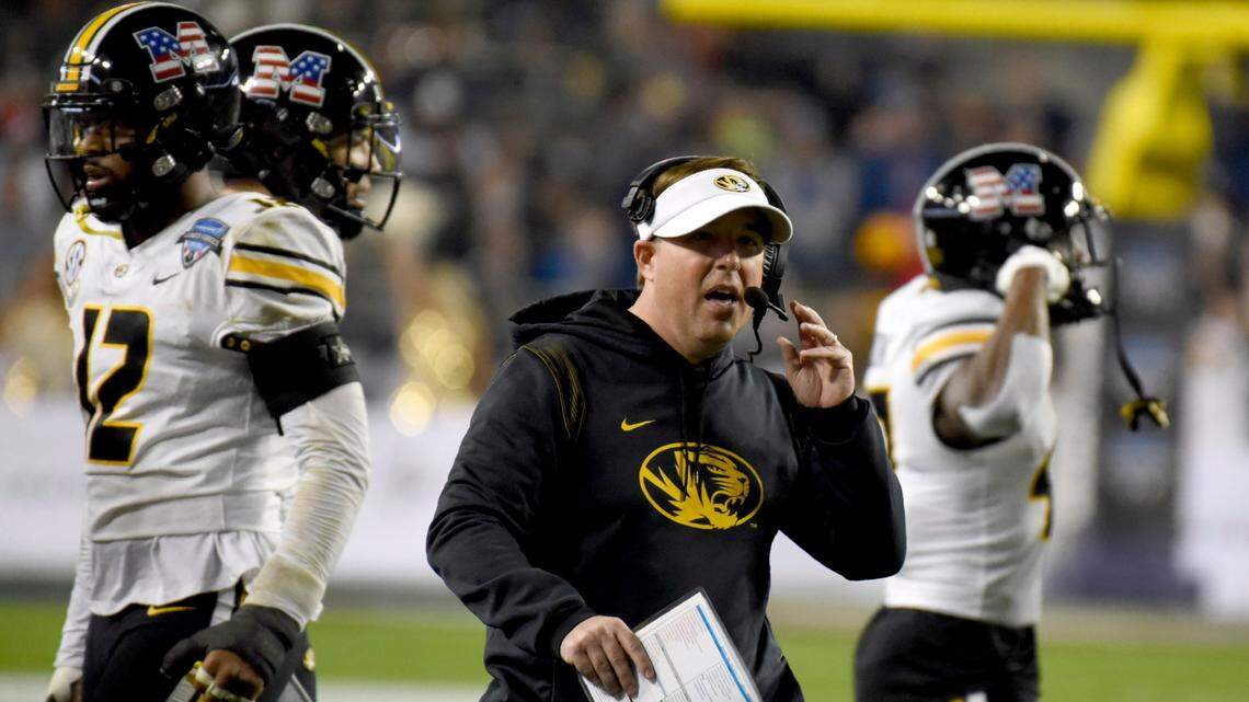 Missouri head coach Eliah Drinkwitz watches play in the first half of the Armed Forces Bowl NCAA college football game against Army in Fort Worth, Texas, Wednesday, Dec. 22, 2021. (AP Photo/Emil Lippe)