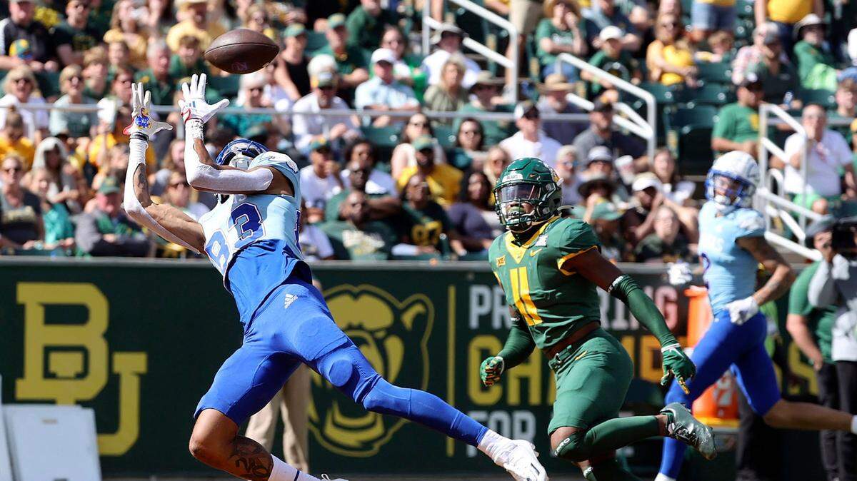 Kansas wide receiver Quentin Skinner catches a pass for a touchdown in front of Baylor cornerback Lorando Johnson in the second half on Saturday, Oct. 22, 2022, in Waco, Texas.