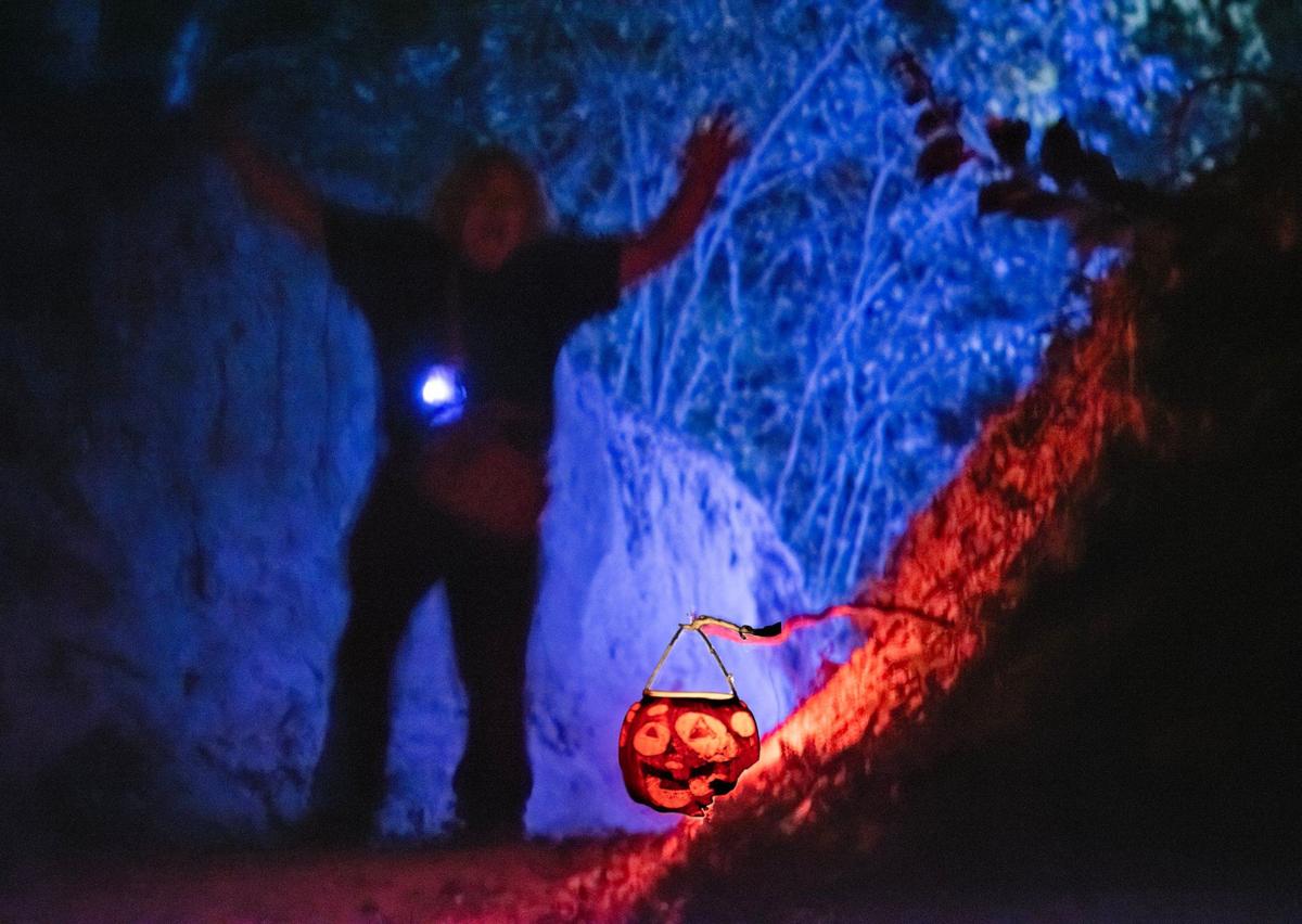 A scary figure stands on the terror trail at Exiled KC-Crooked Rose Woods.