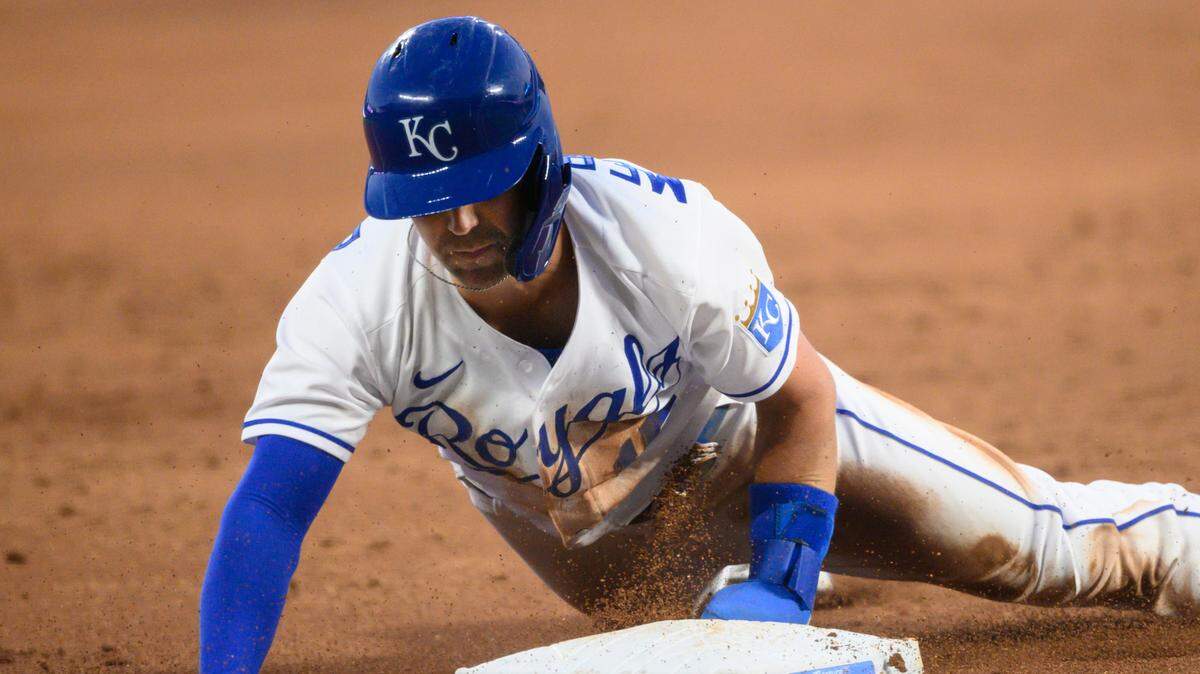Kansas City Royals’ Whit Merrifield steals third base during the third inning of a baseball game against the Cleveland Indians Tuesday, May 4, 2021, in Kansas City, Mo. (AP Photo/Reed Hoffmann)
