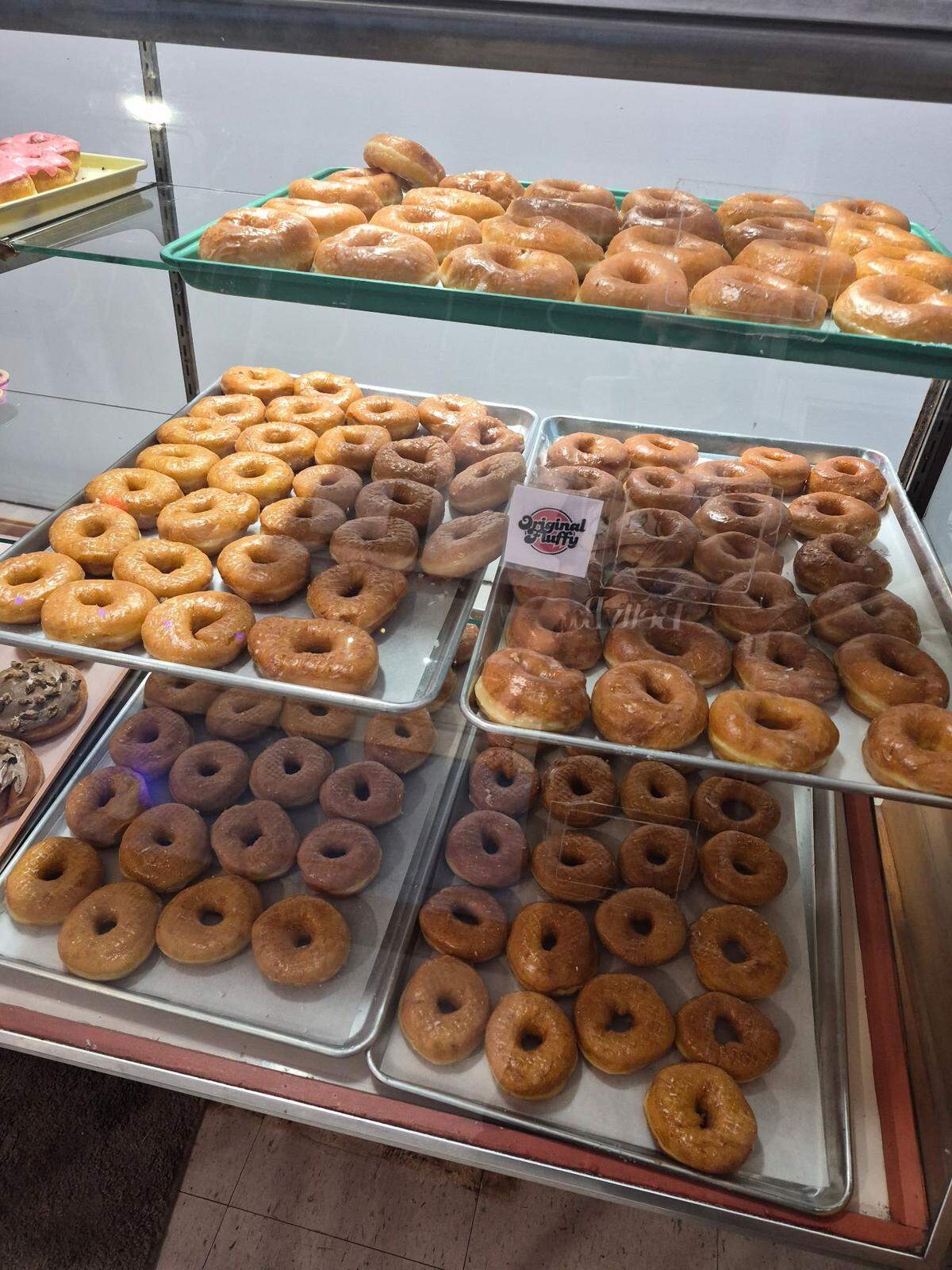 Fluffy Fresh Donuts sold out its opening day by 7:30 a.m., according to owners Eric Benson and Christina Benson.