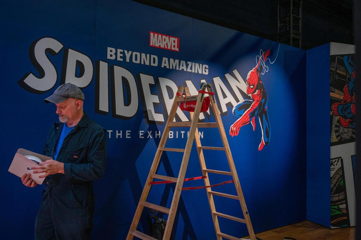 Crew members assemble banners during the set up of “Spider-Man: Beyond Amazing” exhibit at Union Station on Monday, May 22, 2023, in Kansas City.