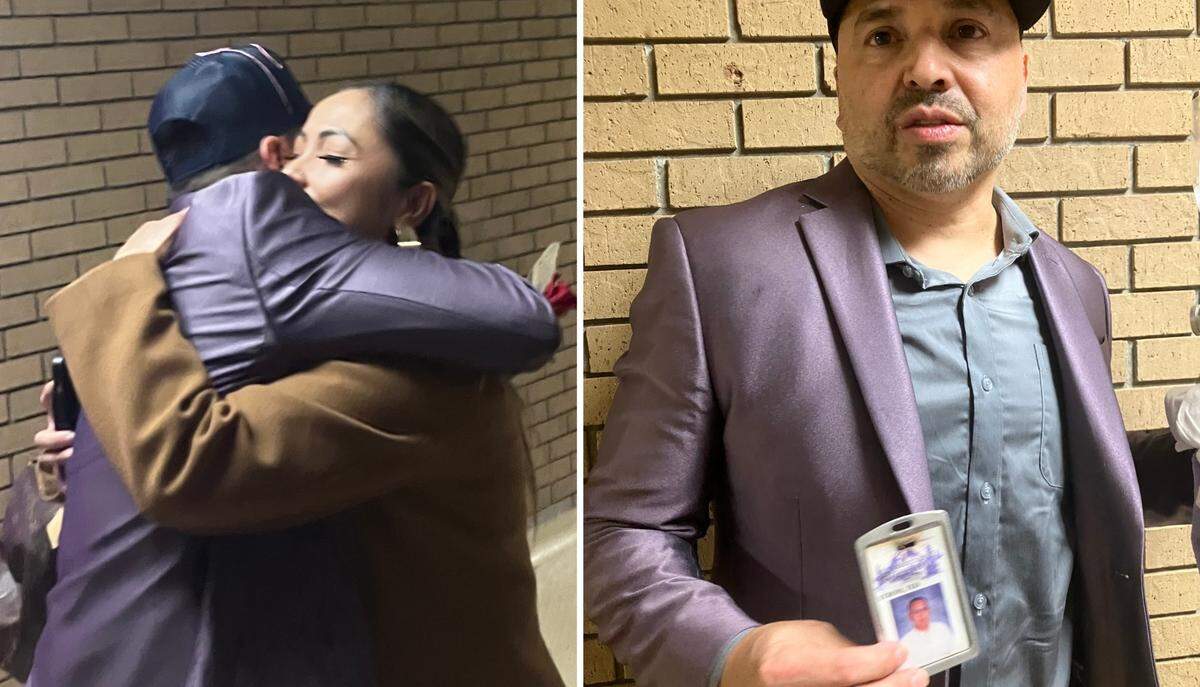 Haskell women’s basketball coach Adam Strom hugs his wife, Relyn, after leading his team to an NAIA Tournament-clinching victory on Sunday, March 2, 2025 in Lawrence, Kansas. At right, Strom holds a picture of his dad, a 30-year high school coach, that he kept in his jacket pocket during the game.