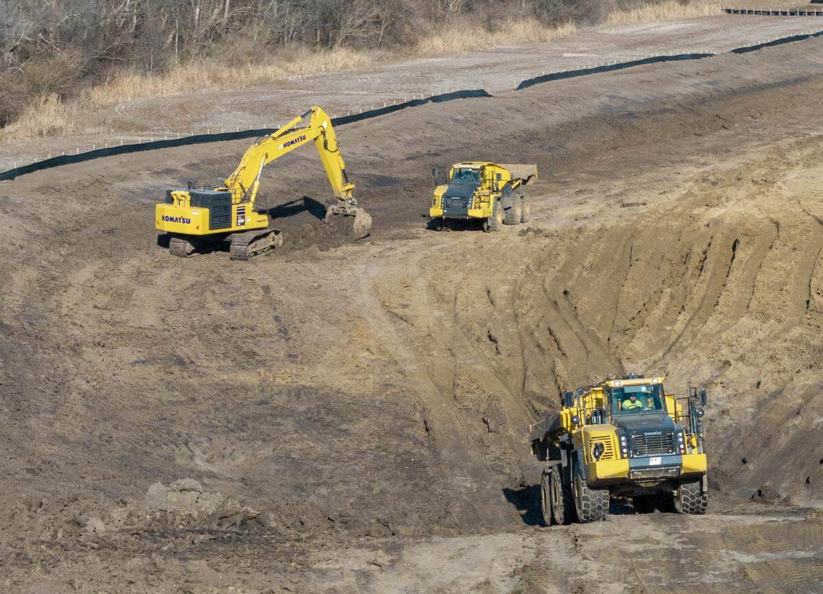 Heavy equipment works on the site of a proposed supersize data center on Bly Road in eastern Independence on Friday, Feb. 13, 2026. Nearby residents oppose the planned 400-acre, $6.6 billion AI facility. 