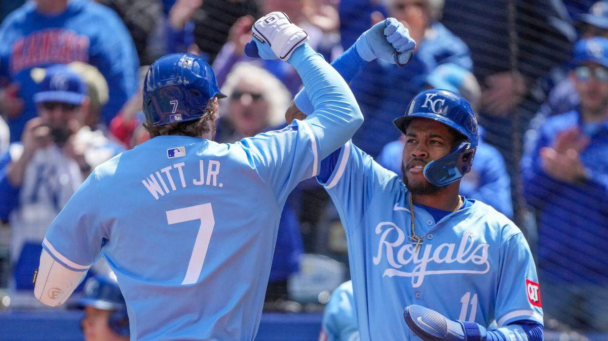 Kansas City Royals shortstop Bobby Witt Jr., left, celebrates his opening-inning home run with third baseman Maikel Garcia during Thursday’s game against the Houston Astros at Kauffman Stadium.