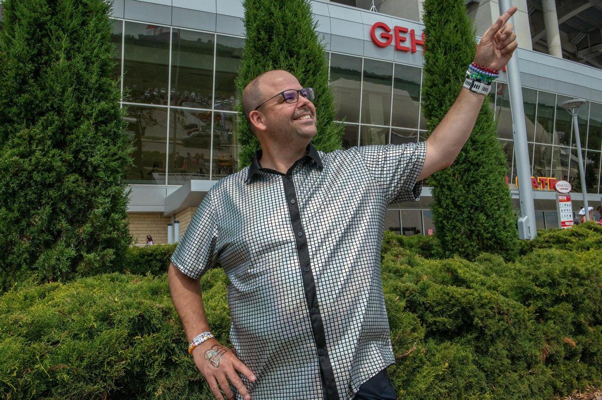 Chad Dalton, a Swiftie dad, showcases his “Mirrorball” shirt at Taylor Swift’s Eras Tour stop at GEHA Field at Arrowhead Stadium on Friday, July 7, 2023, in Kansas City.