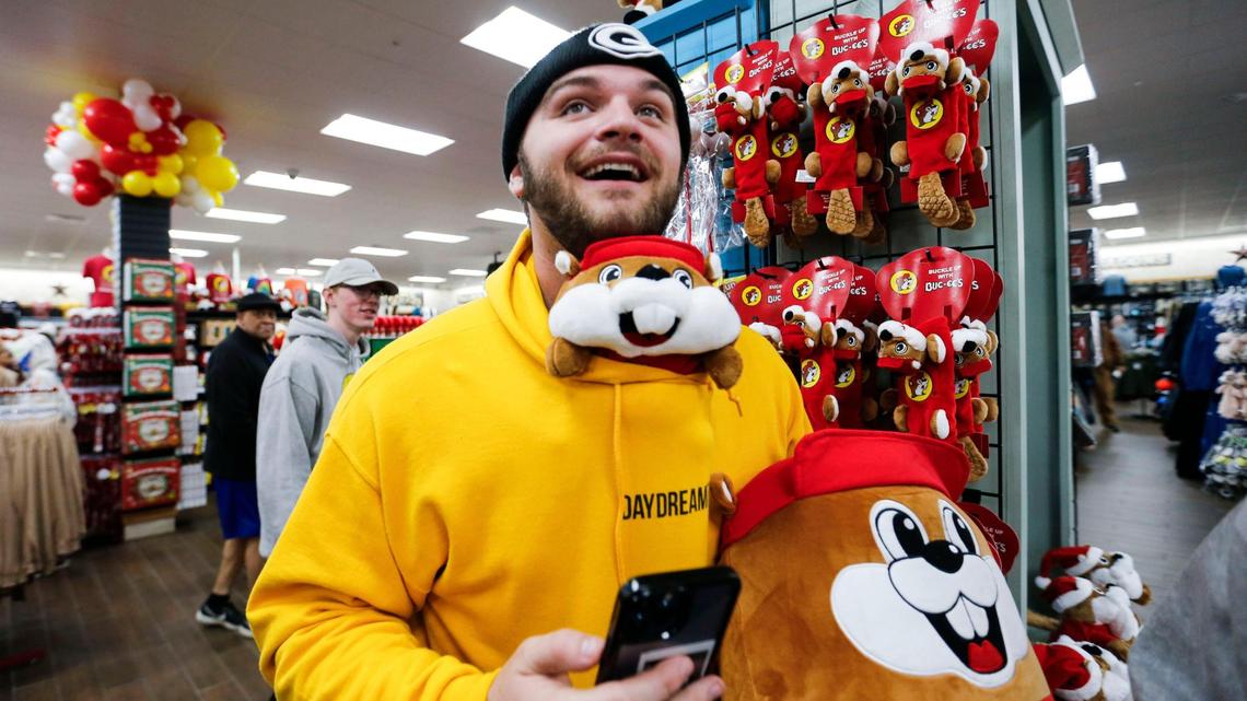 Zack Daugherty makes his way around Missouri’s first Buc-ee’s with a Buc-ee plush toy stuffed inside his shirt.
