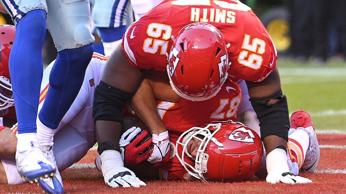 Kansas City Chiefs guard Trey Smith landed on top of tight end Travis Kelce after Kelce ran in for a touchdown in the first quarter against the Dallas Cowboys Sunday, November 21, 2021, at Arrowhead Stadium.