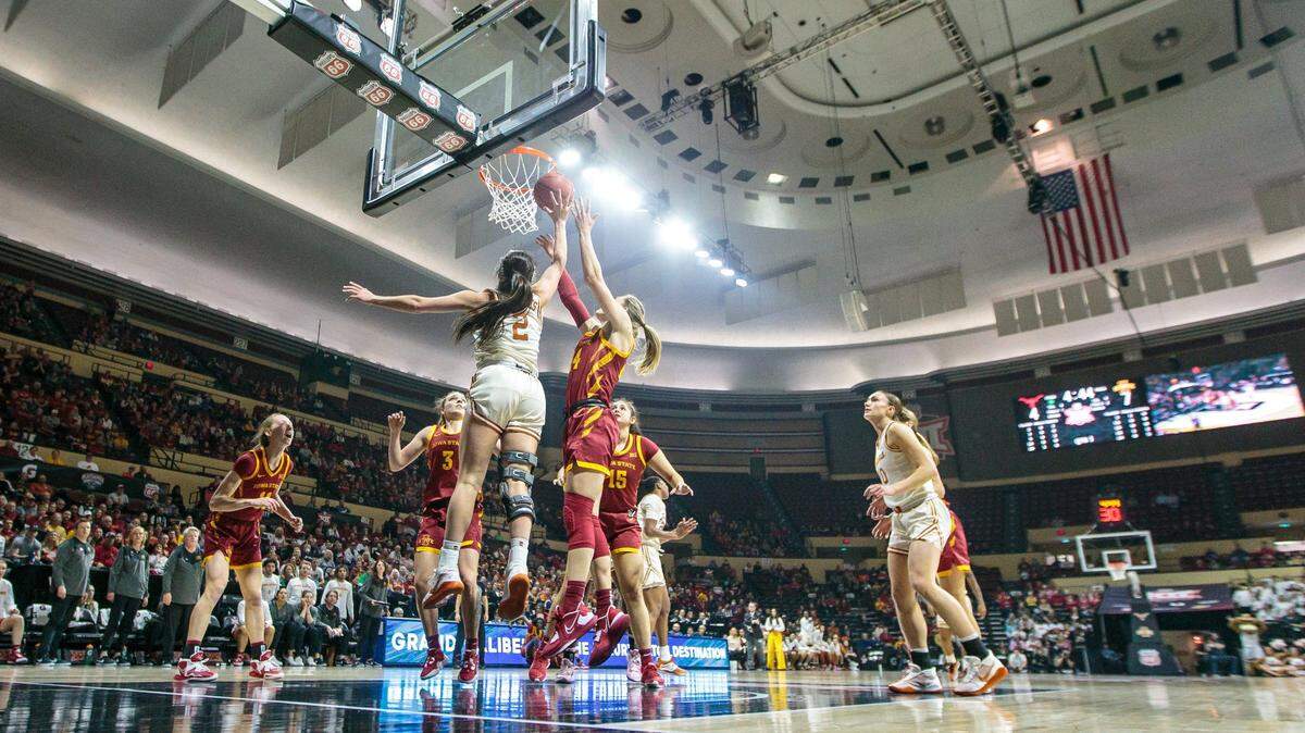 Texas Longhorns guard Shaylee Gonzales (No. 2) puts up a shot alongside Iowa State Cyclones guard Shantavia Dawkins during Sunday’s Big 12 women’s basketball tournament championship game at Municipal Auditorium in Kansas City.