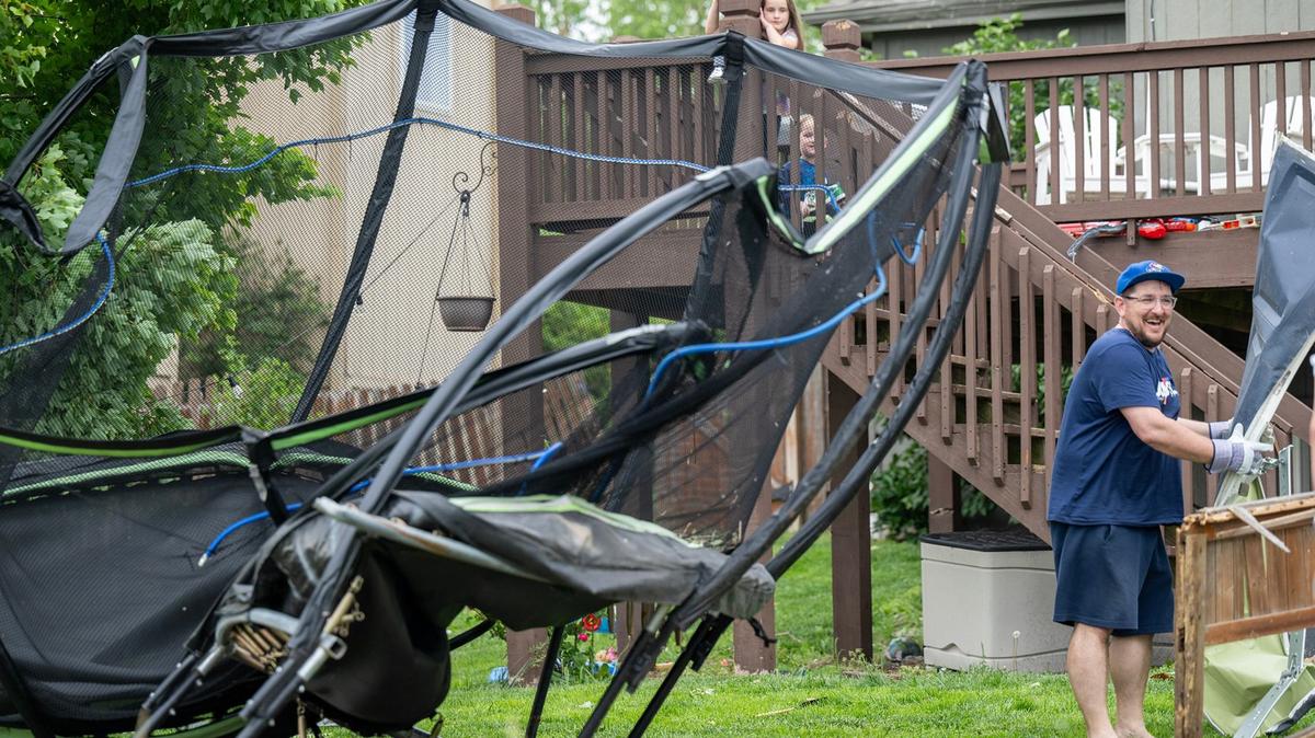 Herschel McWilliams cleaned up storm debris Monday after a tornado hit Sunday night near their home adjacent to Mill Valley High School in Shawnee. The couple and their four children were home in bed when the storm hit. “It could’ve been so much worse,” said Rebecca McWilliams.