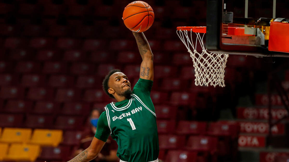 Green Bay guard Amari Davis (1) dunks on a breakaway against Minnesota in the first half of an NCAA college basketball game, Wednesday, Nov. 25, 2020, in Minneapolis. Minnesota won 99-69. (AP Photo/Bruce Kluckhohn)
