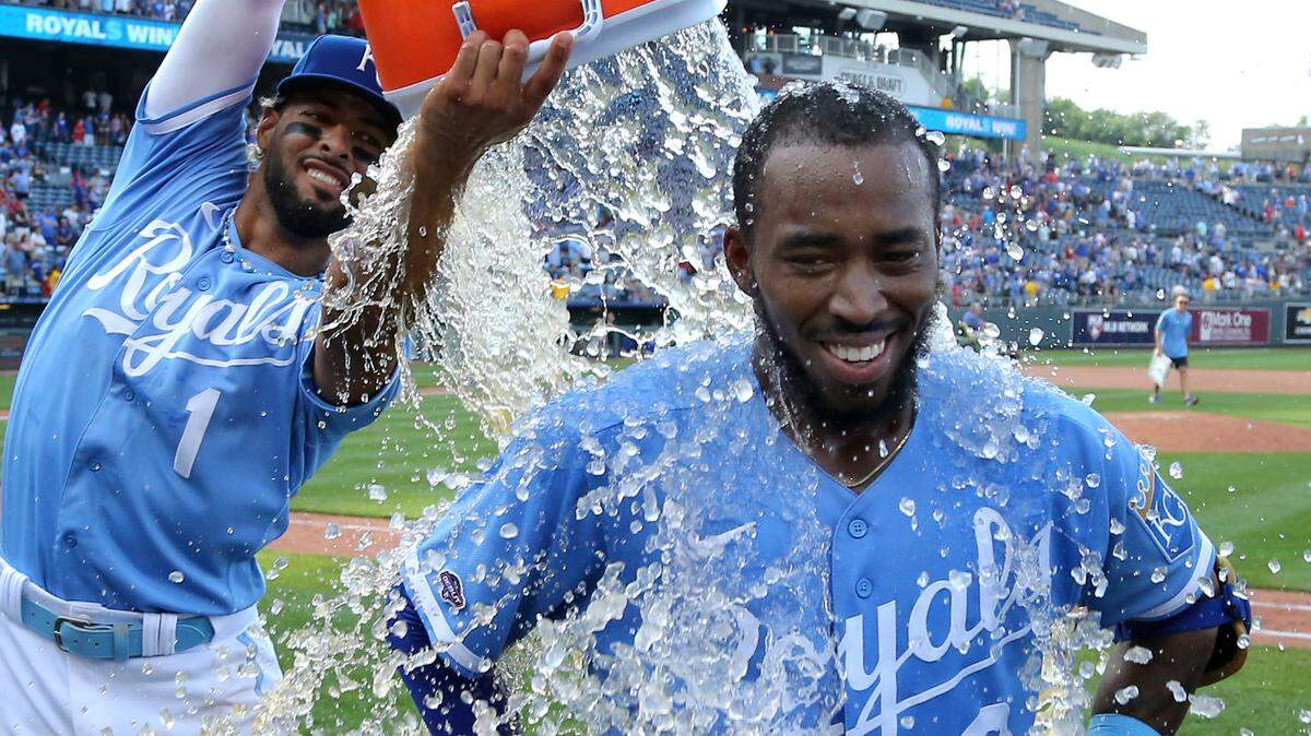 Kansas City Royals left fielder Samad Taylor (0) is doused by water by right fielder MJ Melendez (1) after he hit a game-winning single in his major league debut against the Los Angeles Angels at Kauffman Stadium on June 17, 2023.