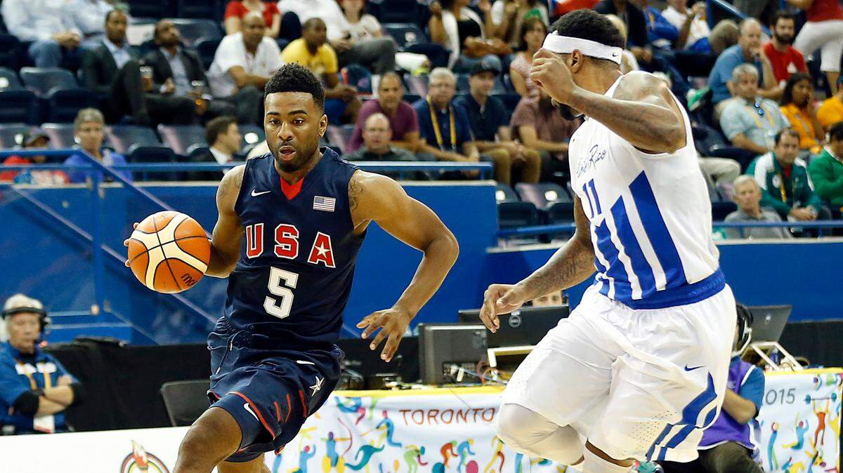 United States’ Keith Langford (5) drives to the basket against Puerto Rico’s Alejandro Carmona (11) in the men’s basketball preliminary round during the 2015 Pan Am Games at Ryerson Athletic Centre in Toronto on July 22, 2015.