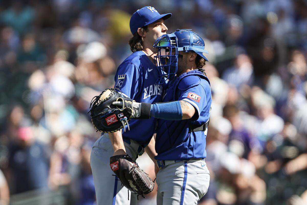 Daniel Lynch IV #41 of the Kansas City Royals hugs Carter Jensen #22 of the Kansas City Royals after beating the Seattle Mariners 4-1 at T-Mobile Park on May 03, 2026 in Seattle, Washington.
