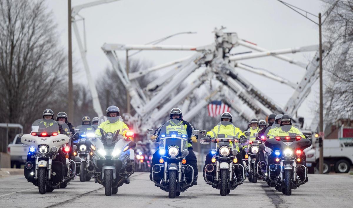 Police motorcycles lead the funeral procession to the Odessa Cemetery for Independence police officer Cody Allen on Friday, March 8, 2024, in Independence. Allen was fatally shot during an eviction in northeast Independence last week.