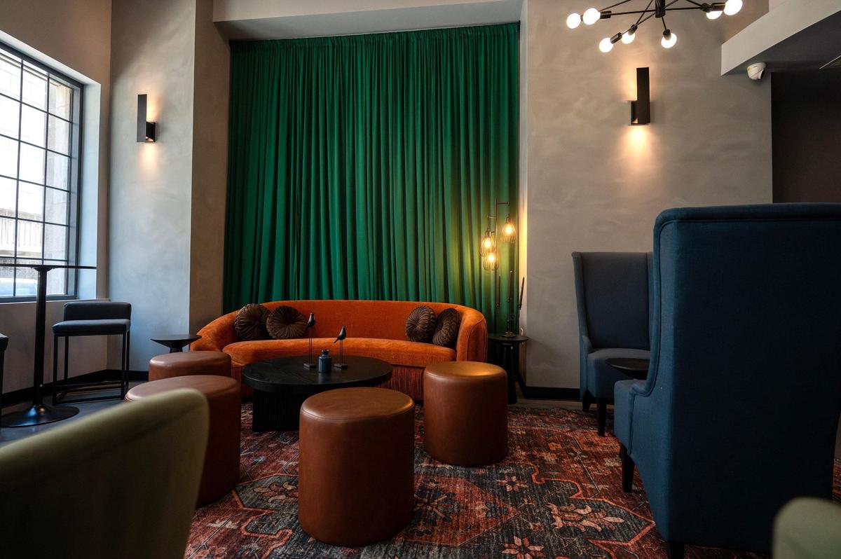Natural light streams through a large window onto the seating area at Kohinoor, a cocktail bar and lounge, on Tuesday, April 8, in Kansas City.