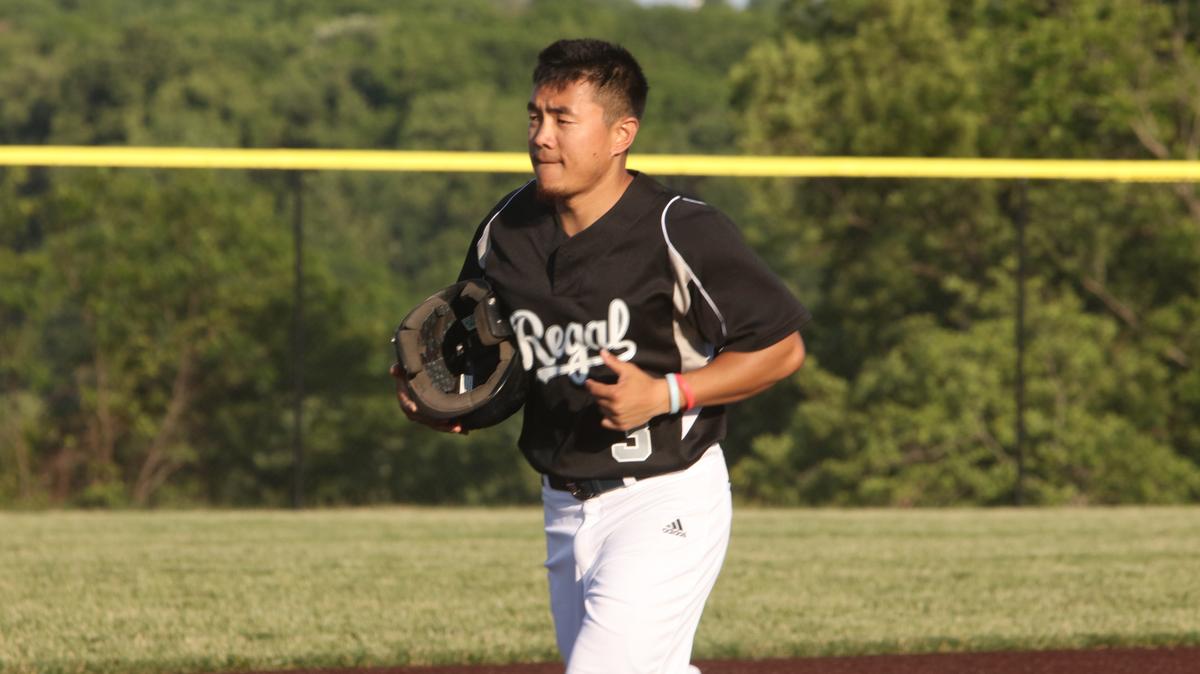 Rockhurst University center fielder DJ Suonandajie jogs off the field during a Ban Johnson Collegiate League game.