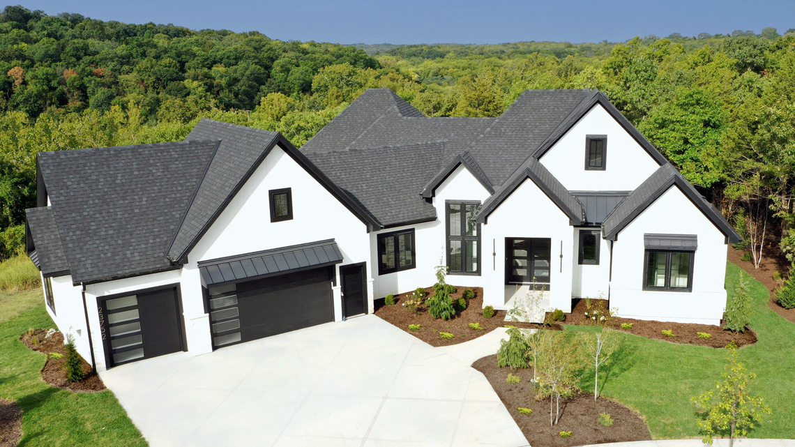 Crestwood Custom Homes is building a unique Reverse 1-1/2 story, six-bedroom home on a heavily wooded estate lot backing to a protected greenspace.