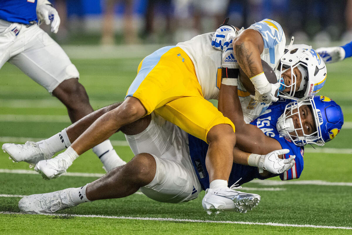 Kansas Jayhawks defensive end Leroy Harris III (33) makes a strong tackle in the first half of the Jayhawks game vs. Long Island University Sharks at David Booth Memorial Stadium on Friday, September 4, 2026, in Lawrence.