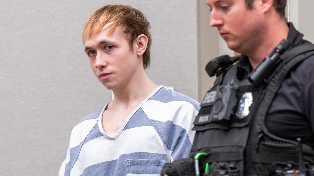 Jace Hanson, left, enters the Johnson County Courthouse for a plea hearing on Thursday, July 3, 2025, in Olathe. Hanson is accused of tampering with food at the former Hereford House Restaurant in Leawood and possessing child sexual abuse material.