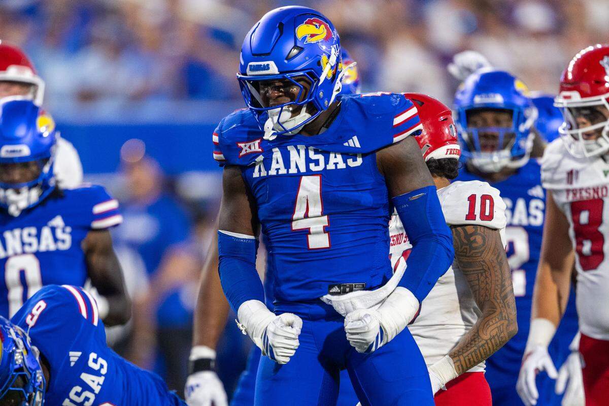 Kansas Jayhawks linebacker Trey Lathan (4) celebrates after making tackle late in the second half of the Jayhawks game vs. the Fresno State Bulldogs on Saturday, Aug. 23, 2025, at David Booth Kansas Memorial Stadium, in Lawrence.