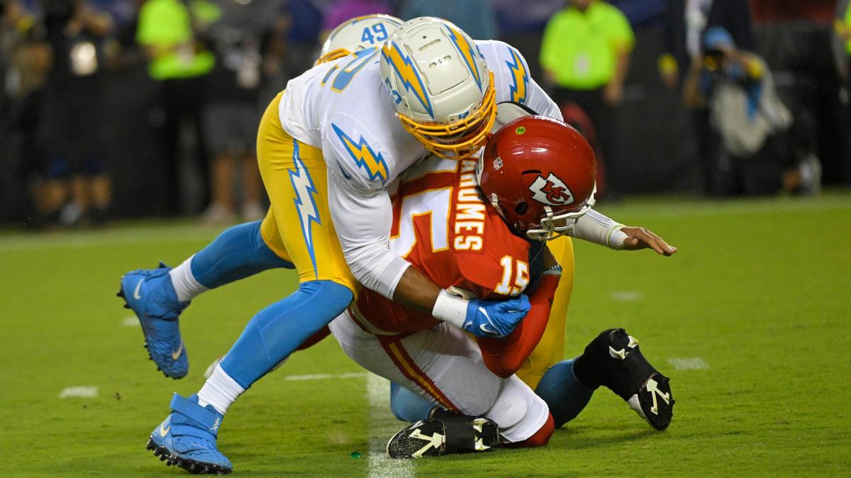 Kansas City Chiefs Patrick Mahomes gets sacked by Los Angeles Chargers Khalil Mack in the first-half on Thursday, Aug. 15,2022 at Arrowhead Stadium in Kansas City.