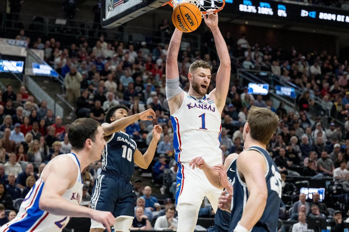 Kansas Jayhawks center Hunter Dickinson (1) dunks the ball against the Samford Bulldogs during a men’s college basketball game in the first round of the NCAA Tournament on Thursday, March 21, 2024, in Salt Lake City, Utah.