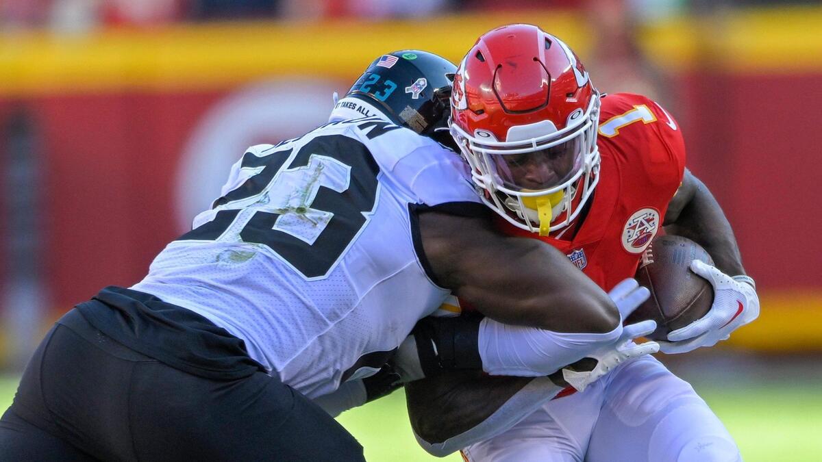 Kansas City Chiefs running back Jerick McKinnon (1) runs for a first down as Jacksonville Jaguars linebacker Foyesade Oluokun (23) tackles him during the first half on Sunday, Nov. 13, 2022, at Arrowhead Stadium in Kansas City.