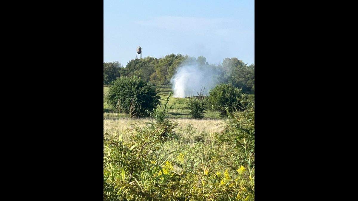 South Metro Fire District crews were working to repair a large gas line break in a field in Raymore Friday morning.