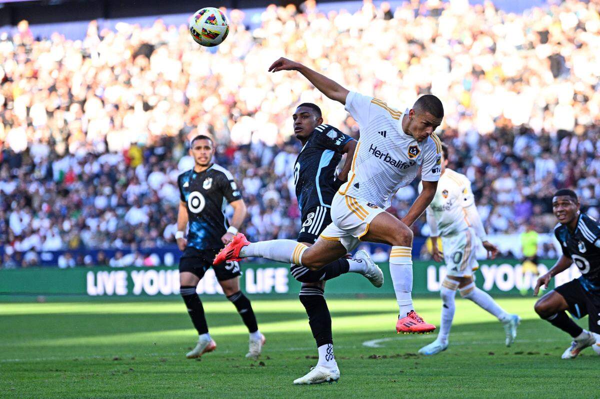 L.A. Galaxy forward Dejan Joveljic (foreground) fights for a ball during an MLS playoff match against Minnesota United FC at Dignity Health Sports Park in Carson, Calif. on Nov. 24, 2024.