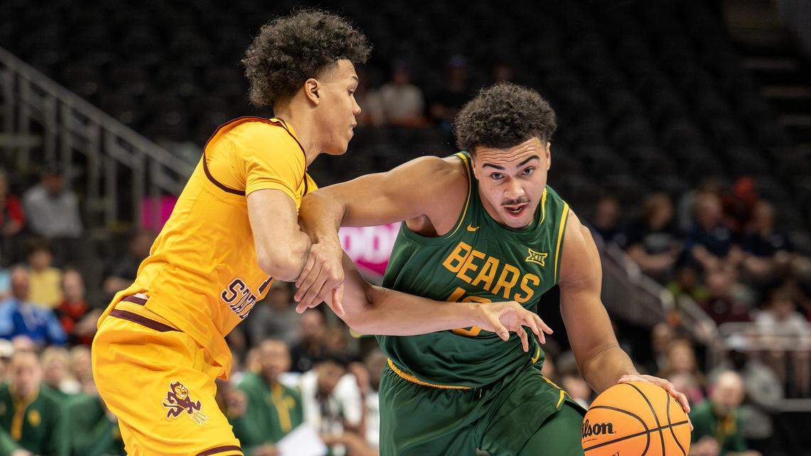 Baylor Bears guard Isaac Williams (10) dribbles the ball down the court blocking Arizona State Sun Devils guard Bryce Ford (4) during the first half of the Big 12 Men's Basketball Tournament at T-Mobile Center on Tuesday, March 10, 2026, in Kansas City.