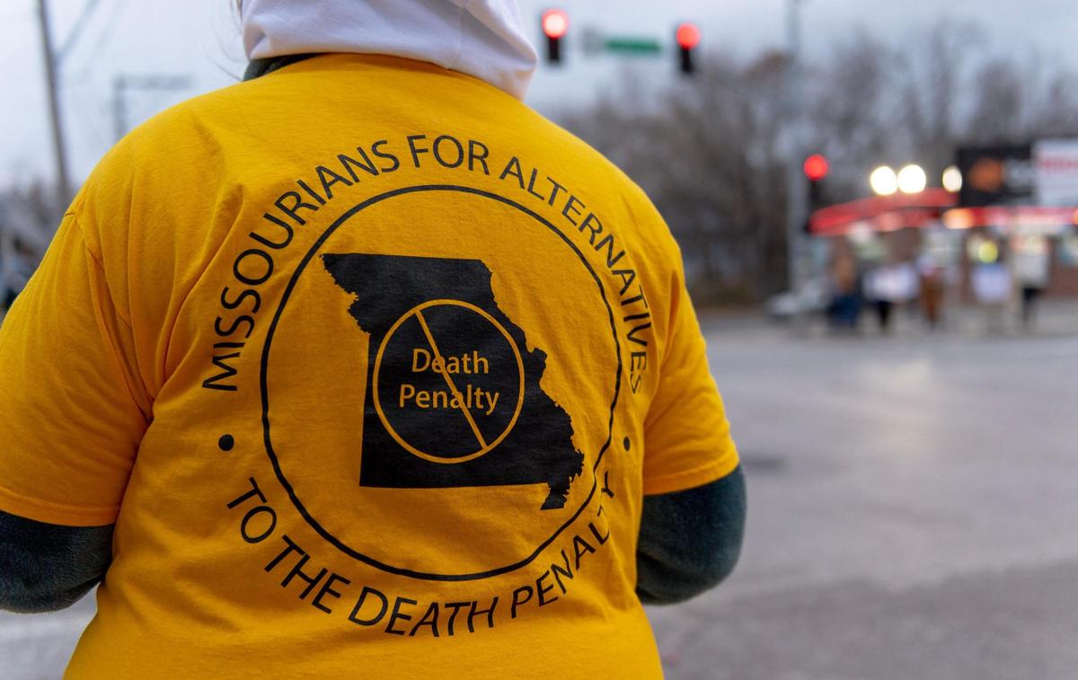 People protest the planned execution of Missouri prisoner Kevin Johnson on Tuesday, Nov. 29, 2022, in Kansas City.