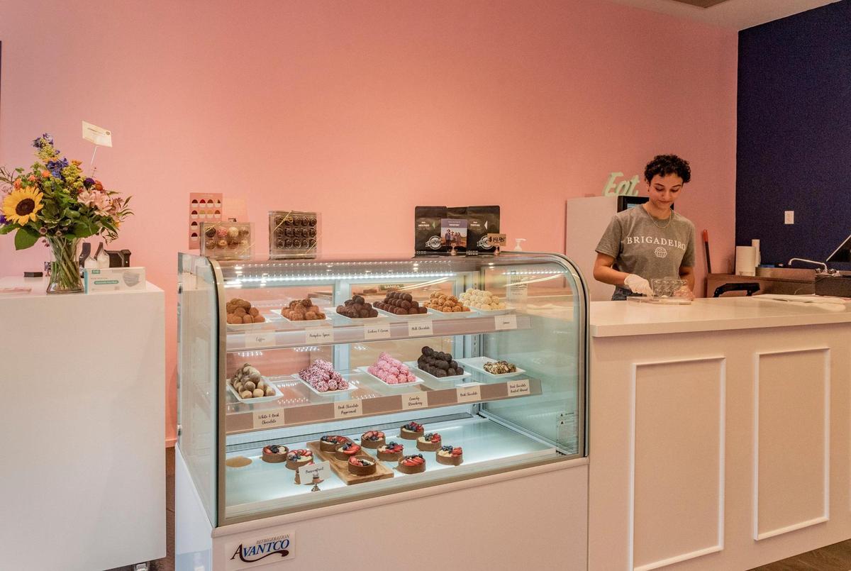 Alyssa Lopez boxed candies for a customer at Sweet Kiss Brigadeiro.