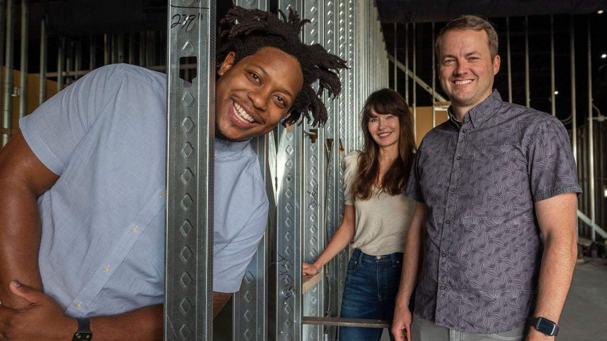 Managing partner Ty Hardamon, left, and owners Braden Holcomb and Caroline Irving showed off the space for their Brkthrough entertainment center, now under construction.