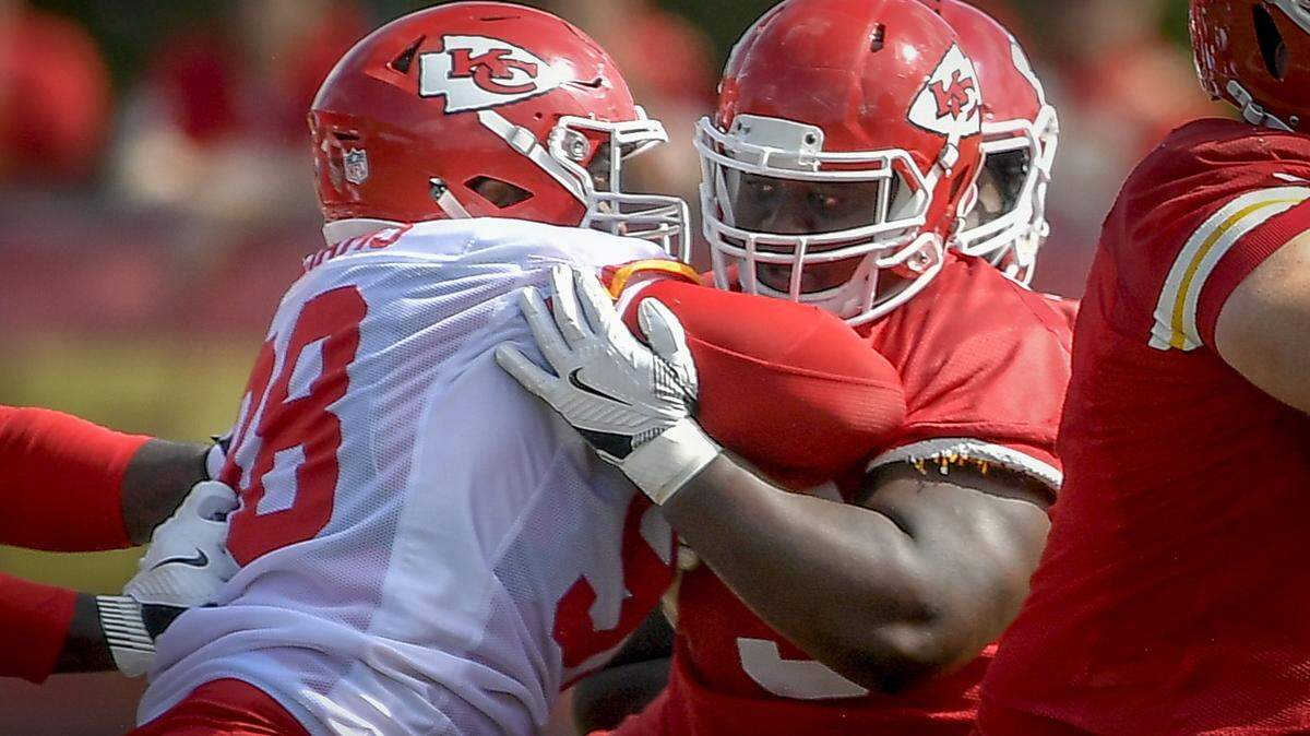 Kansas City Chiefs center Tejan Koroma (73) blocks Kansas City Chiefs defensive tackle Xavier Williams (98) during training camp at Missouri Western State University on Monday, July 30 2018, in St. Joseph, Missouri.