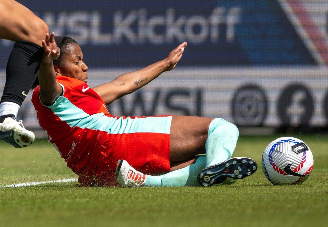 Kansas City Current defender Elizabeth Ball (7) goes after the ball during the home opener against the Portland Thorns at CPKC Stadium on Saturday, March 16, 2024, in Kansas City.