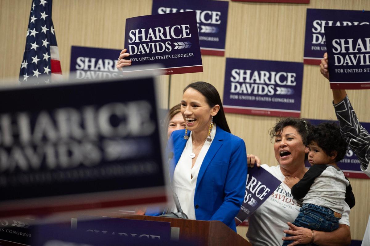 Kansas 3rd District Rep. Sharice Davids greets a crowd of supporters to give her victory speech at the Sheraton Hotel in Overland Park after defeating challenger Amanda Adkins in the midterm election Tuesday, Nov. 8, 2022.