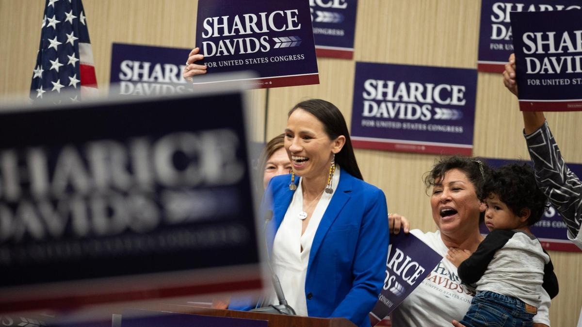 Kansas 3rd District Rep. Sharice Davids greets a crowd of supporters to give her victory speech at the Sheraton Hotel in Overland Park after defeating challenger Amanda Adkins in the midterm election Tuesday, Nov. 8, 2022.