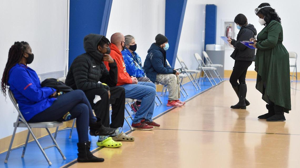 Workers from Vibrant Health gathered information as clients waited for COVID-19 testing, which was in high-demand Monday, Jan. 3, 2022.