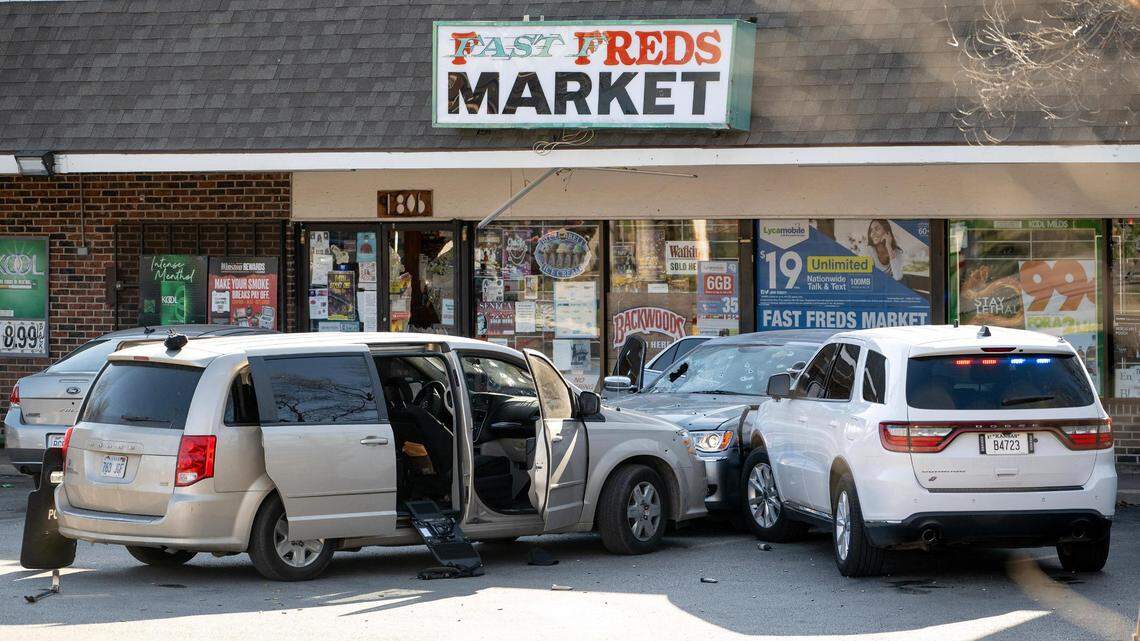Police shields, gun magazines and shot out windshields remain in the parking lot of Fast Freds Market after police tried to arrest suspects in an undercover investigation of fentanyl dealing on Wednesday, April 5, 2023, in Kansas City, Kan.