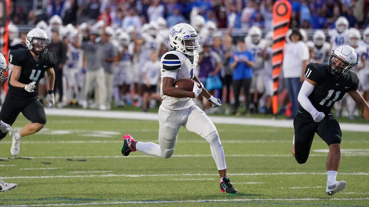 Randy Singleton outraces Mill Valley defenders for one of his three touchdowns in Gardner-Edgerton’s 49-10 win on Friday.