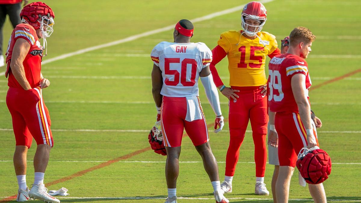Kansas City Chiefs players including quarterback Patrick Mahomes, 15, warm up during the first padded practice at Chiefs training camp on Monday, Aug., 1 2022, in St. Joseph.